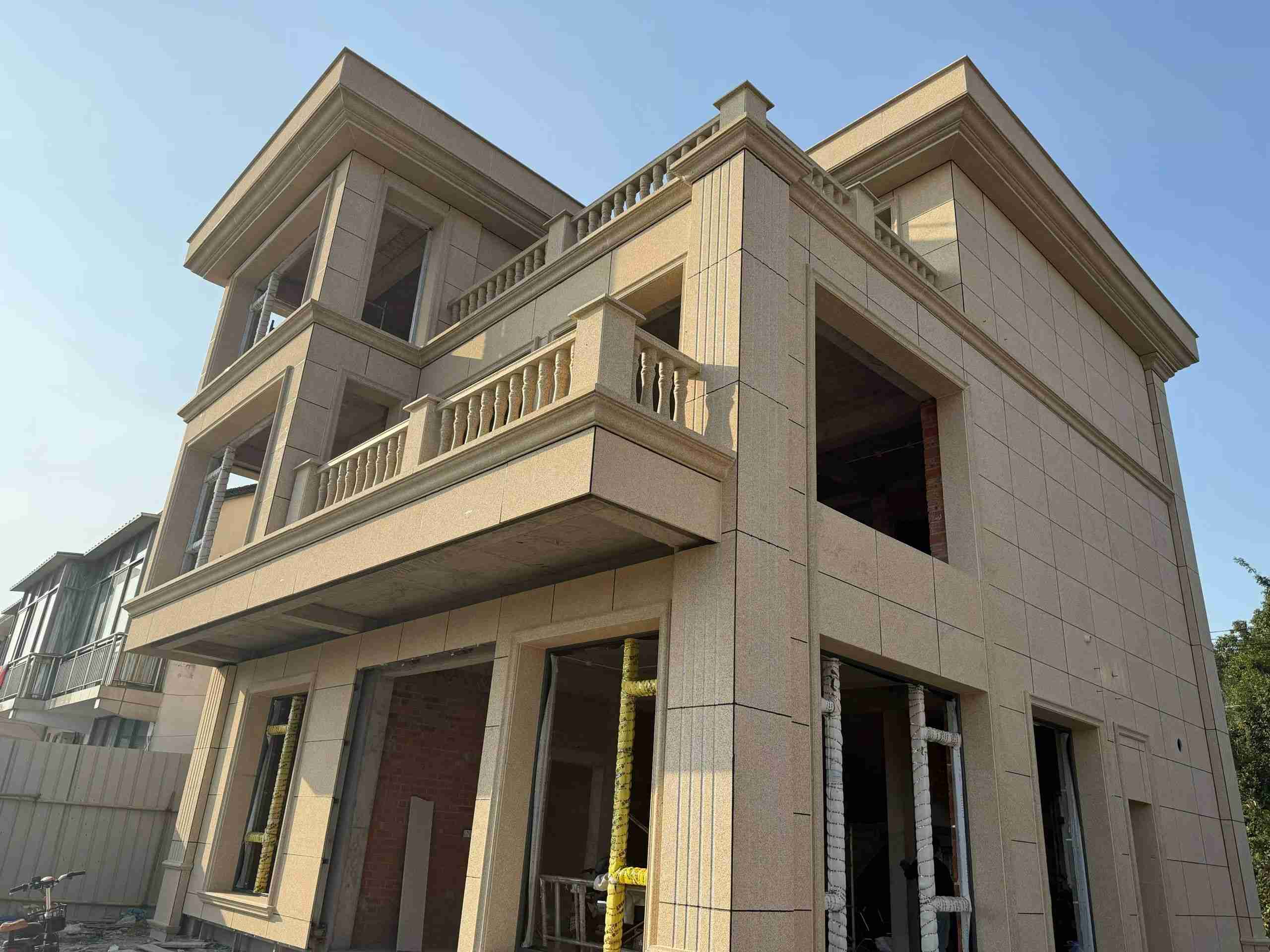 黑河 黄金麻花岗岩石材荔枝面外墙干挂效果展示